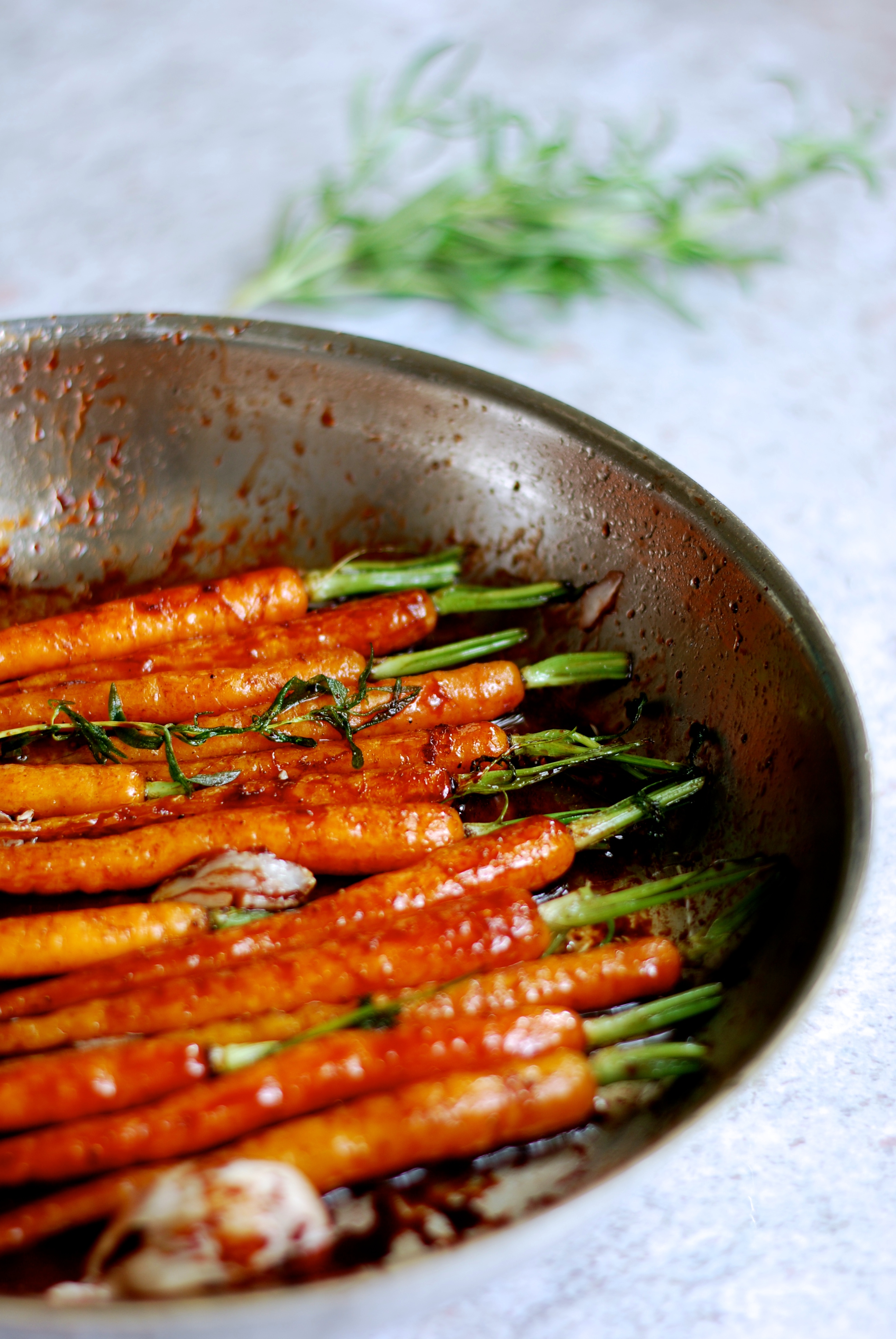 Image of DATE SYRUP GLAZED CARROTS WITH CINNAMON AND ROSEMARY